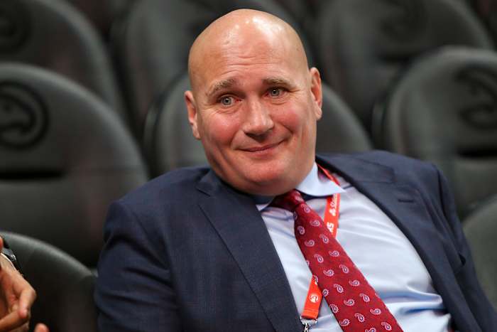 Travis Schlenk watches a game from the stands.